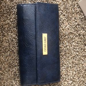 A blue leather jimmy choo wallet